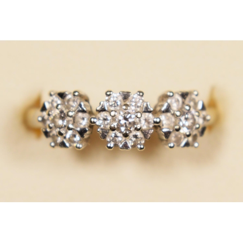 78 - An 18ct white gold triple cluster ring, heart claw set with brilliant cut stones, stated weight 0.50... 