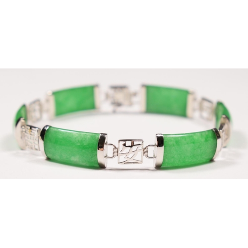 79 - A Chinese 14K white gold and jade panel link bracelet, untested for colour enhancement, 18cm, 11gm.