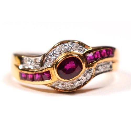 81 - An 18ct gold (750) ruby and diamond ring, collet set with an oval mixed cut stone , flanked by bague... 