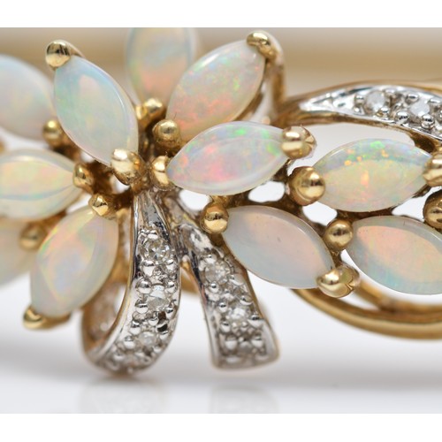 86 - A 9K gold opal and diamond floral spray fronted bracelet, 59 x 50mm internal, 10.8gm