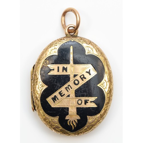 91 - A Victorian gold and black enamel mourning locket, tests as 15ct, opening to reveal an original lock... 