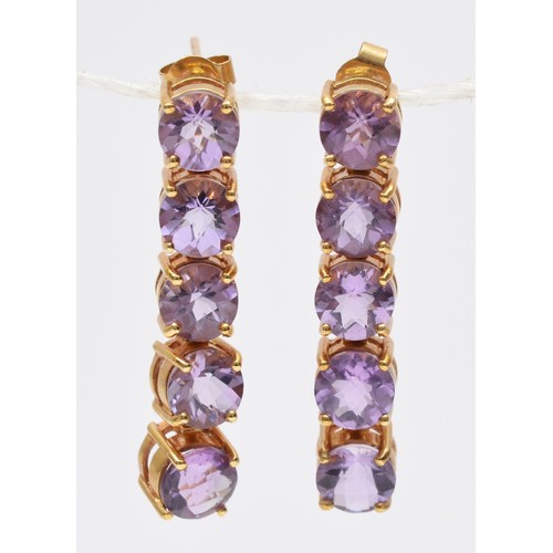 94 - A 9ct gold pair of amethyst drop earrings, articulated claw set with facetted stones, length 33mm, 6... 