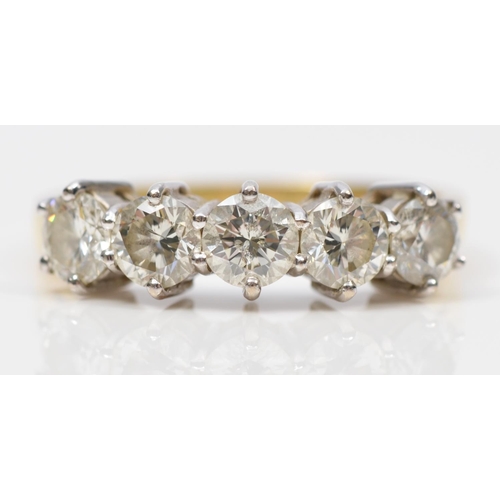 105 - An 18ct gold five stone diamond ring, claw set with brilliant cut stones, stated weight 1.50cts, col... 