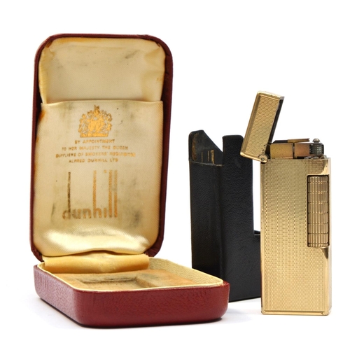 127 - Dunhill, a 9ct gold rollagas cigarette lighter, London 1967, with engine turned decoration, 105gm, o... 