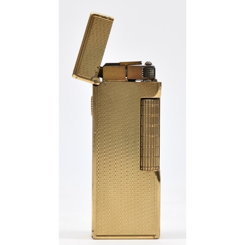 127 - Dunhill, a 9ct gold rollagas cigarette lighter, London 1967, with engine turned decoration, 105gm, o... 