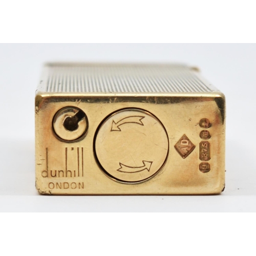 127 - Dunhill, a 9ct gold rollagas cigarette lighter, London 1967, with engine turned decoration, 105gm, o... 