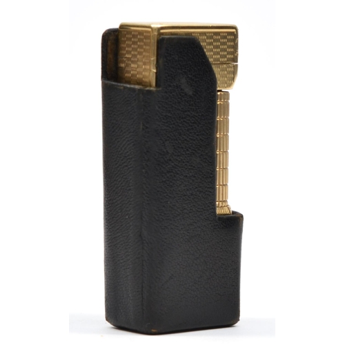 127 - Dunhill, a 9ct gold rollagas cigarette lighter, London 1967, with engine turned decoration, 105gm, o... 