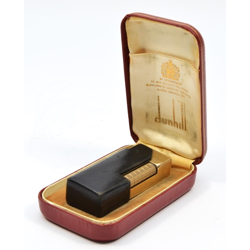 127 - Dunhill, a 9ct gold rollagas cigarette lighter, London 1967, with engine turned decoration, 105gm, o... 