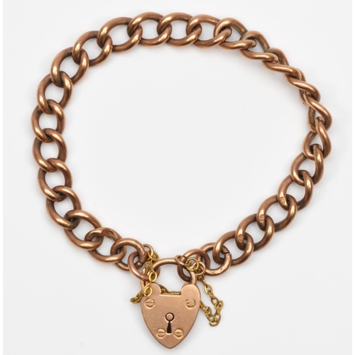 121 - An Edwardian 9ct rose hollow gold curb link bracelet, heart shaped padlock clasp, each link stamped ... 