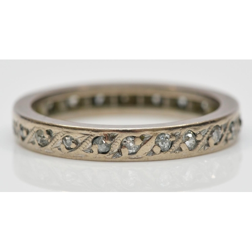 122 - A white metal and diamond full eternity ring, probably platinum, set with single cut stones, L, 3.7g... 