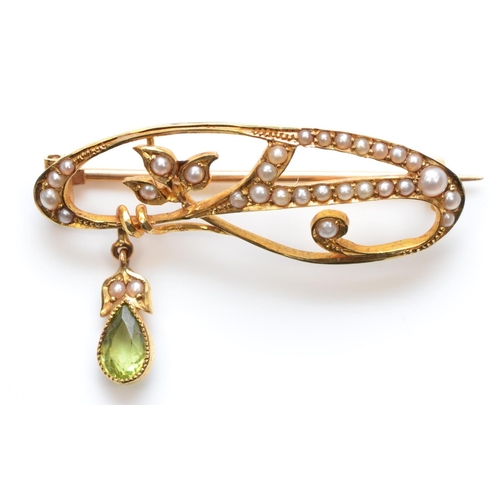 123 - A Victorian 15ct gold peridot and half pearl scroll brooch, stamped 15ct, 35mm, 3.6gm