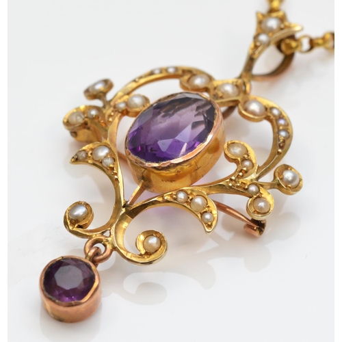 124 - A Victorian 9ct gold, amethyst and half pearl openwork scroll brooch pendant, 42mm overall, to a 9ct... 