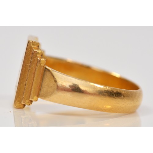 126 - A gold signet ring, scratched 22K, with KE monogram, U, 9.1gm