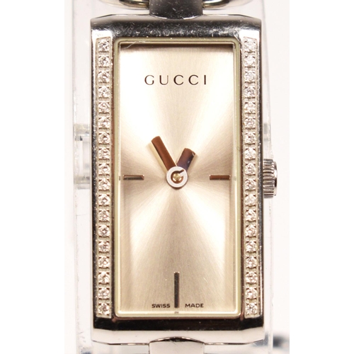 135 - A Gucci, Tornabuoni, stainless steel and brilliant cut diamond set quartz ladies wristwatch, ref 119... 