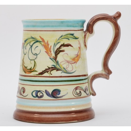 173 - A Denby tapering tankard, with floral scroll decoration, signed to base, 14cm.