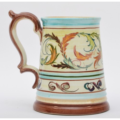 173 - A Denby tapering tankard, with floral scroll decoration, signed to base, 14cm.