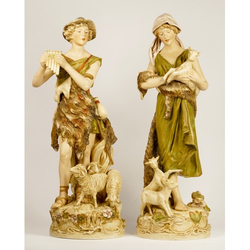 180 - A Royal Dux pair of Shepherd playing the pipes, number 570, and Shepherdess with goats, number 580, ... 