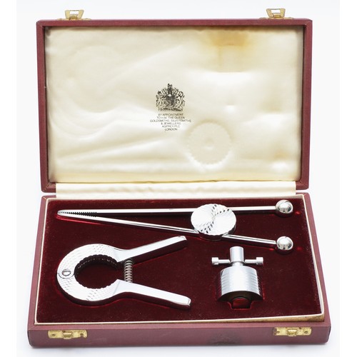 196 - Asprey, London, a chrome champagne cork remover, adjustable cork and ice tongs, unmarked, retailers ... 