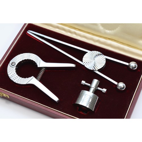 196 - Asprey, London, a chrome champagne cork remover, adjustable cork and ice tongs, unmarked, retailers ... 