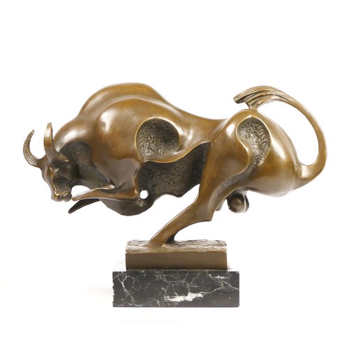 201 - Milo, a Modernist bronze figure of a charging bull, signed, mounted on an onyx base, 34cm.