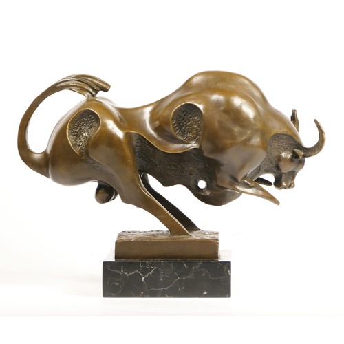 201 - Milo, a Modernist bronze figure of a charging bull, signed, mounted on an onyx base, 34cm.