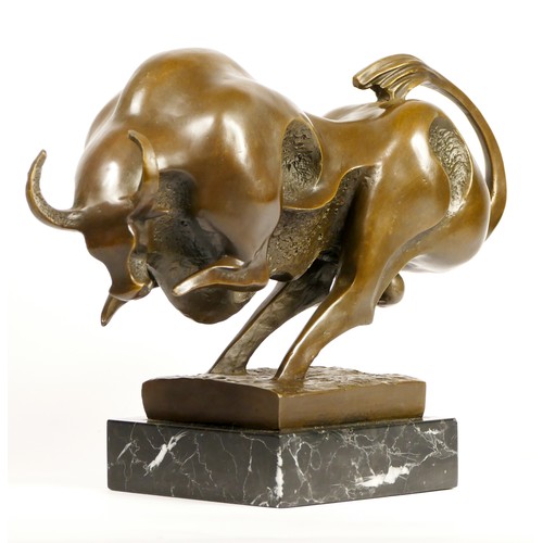 201 - Milo, a Modernist bronze figure of a charging bull, signed, mounted on an onyx base, 34cm.