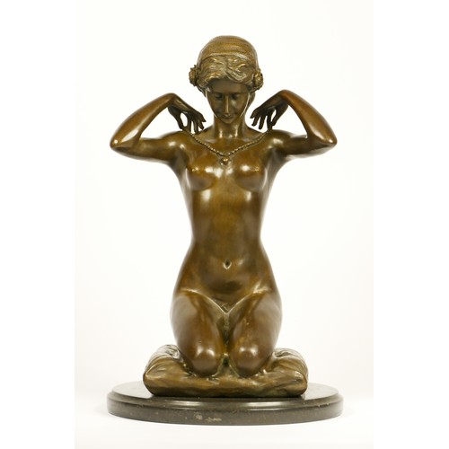 203 - After Paul Ponsard, a bronze of a kneeling nude lady “New Necklace”, raised on an onyx base, 30cm.