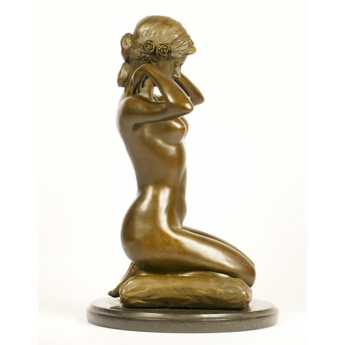 203 - After Paul Ponsard, a bronze of a kneeling nude lady “New Necklace”, raised on an onyx base, 30cm.