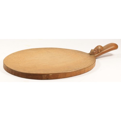 209 - A Robert Mouseman Thompson of Kilburn, oval oak cheese board, with carved mouse trademark, 39cm.