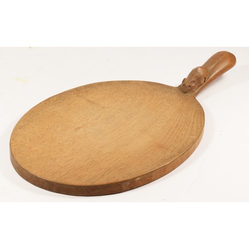 209 - A Robert Mouseman Thompson of Kilburn, oval oak cheese board, with carved mouse trademark, 39cm.