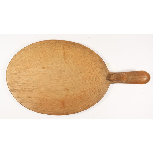 209 - A Robert Mouseman Thompson of Kilburn, oval oak cheese board, with carved mouse trademark, 39cm.