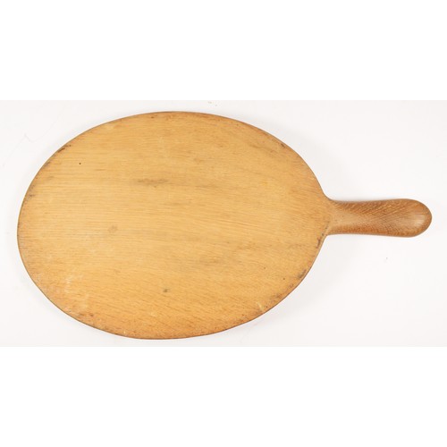 209 - A Robert Mouseman Thompson of Kilburn, oval oak cheese board, with carved mouse trademark, 39cm.