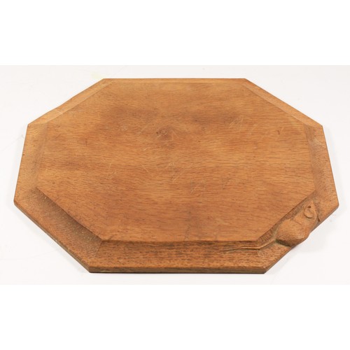 210 - A Robert Mouseman Thompson of Kilburn, octagonal oak cheese board, with carved mouse trademark, 31 x... 