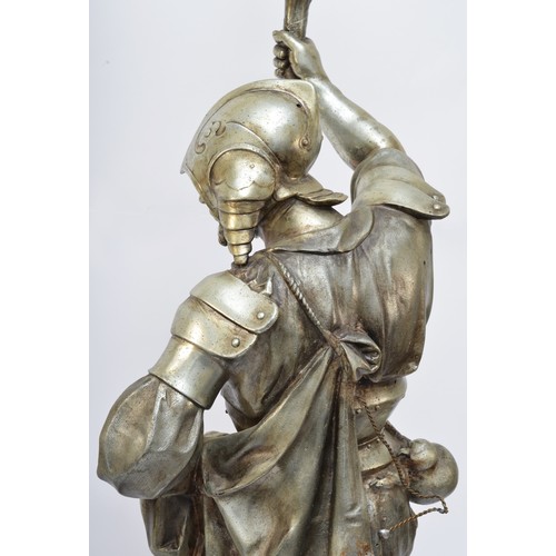 212 - A late 19th/early 20th century French silvered metal figural lamp, in the form of a 16th century war... 