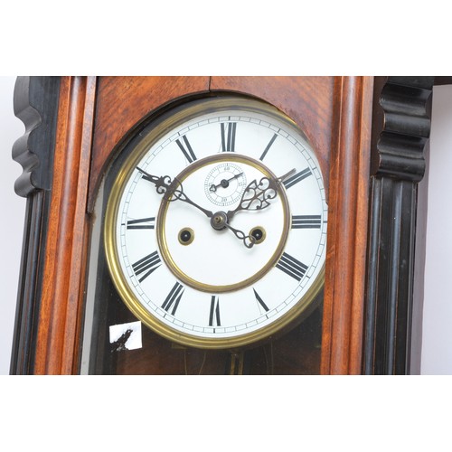 301 - A 19th century Viennese double weight wall clock, the two part white enamel dial with Roman numerals... 