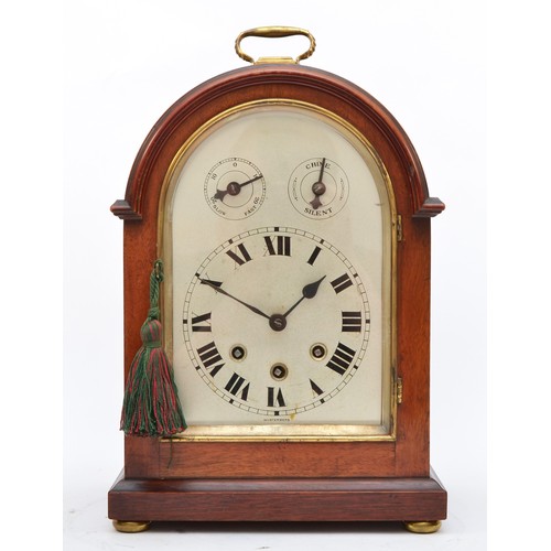 286 - An early 20th century German arched mahogany mantel clock, the silvered dial with subsidiary slow/fa... 