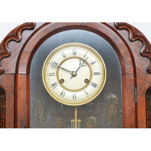 299 - A late 19th century German walnut wall clock, the two part dial with Roman numerals, the case with m... 