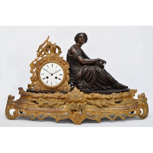 295 - A 19th century French bronzed spelter and gilt metal mantel clock, the white enamel with Roman numer... 