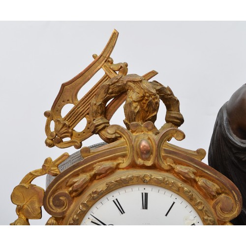 295 - A 19th century French bronzed spelter and gilt metal mantel clock, the white enamel with Roman numer... 