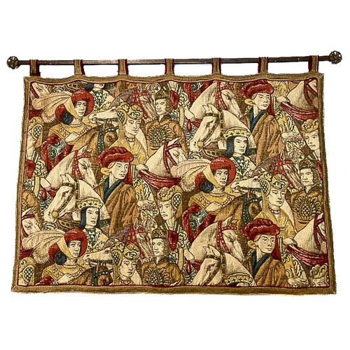 224 - A 20th century wall tapestry worked in various vibrant coloured wools, depicting medieval figures on... 