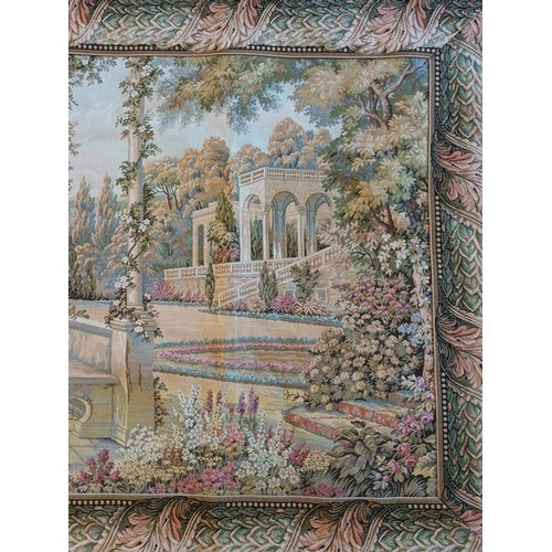 226 - A wall hanging tapestry, depicting a lakeside palace gardens, 100 x 180cm, together with a smaller e... 