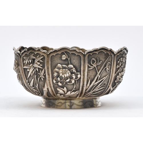 236 - A Chinese silver bowl, by Wang Hing & Co., Hong Kong, each panel with different embossed and chased ... 