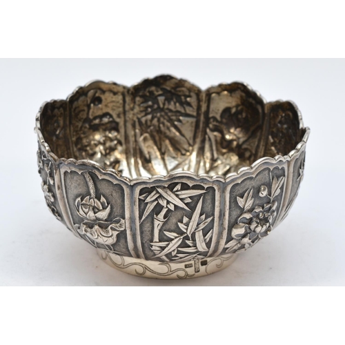 236 - A Chinese silver bowl, by Wang Hing & Co., Hong Kong, each panel with different embossed and chased ... 