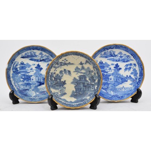 239 - Two Chinese 18th century Nanking porcelain ribbed dishes, with pagoda decoration, gilt band, 14.5cm ... 