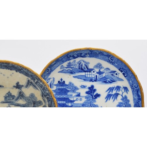 239 - Two Chinese 18th century Nanking porcelain ribbed dishes, with pagoda decoration, gilt band, 14.5cm ... 