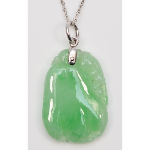 240 - A 14K white gold mounted carved jadeite fruit pendant, 30 x 20mm, 14K white gold chain.