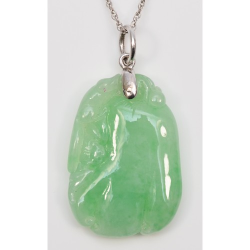 240 - A 14K white gold mounted carved jadeite fruit pendant, 30 x 20mm, 14K white gold chain.