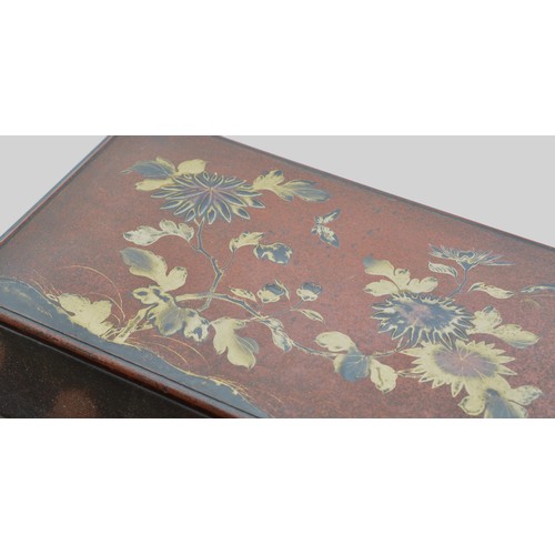 245 - A Japanese lacquer jewellery box, with red and gold floral decoration, hinged lid revealing a fitted... 