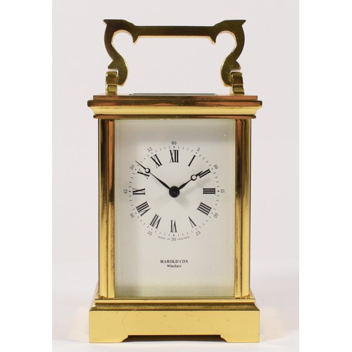 254 - A Harold Cox, Windsor, brass striking carriage clock, white enamel dial, the 13 jewel movement strik... 