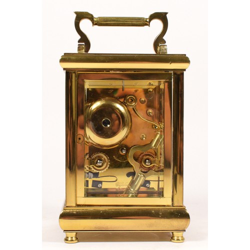 258 - A Taylor & Bligh, brass striking carriage clock, white enamel dial with Roman numerals, the 11 jewel... 